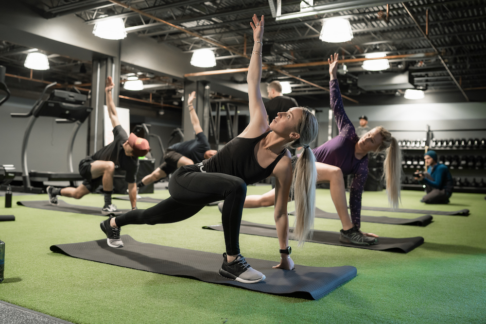 Yoga Class at Dryland Fitness Breckenridge - Stretching on yoga mat