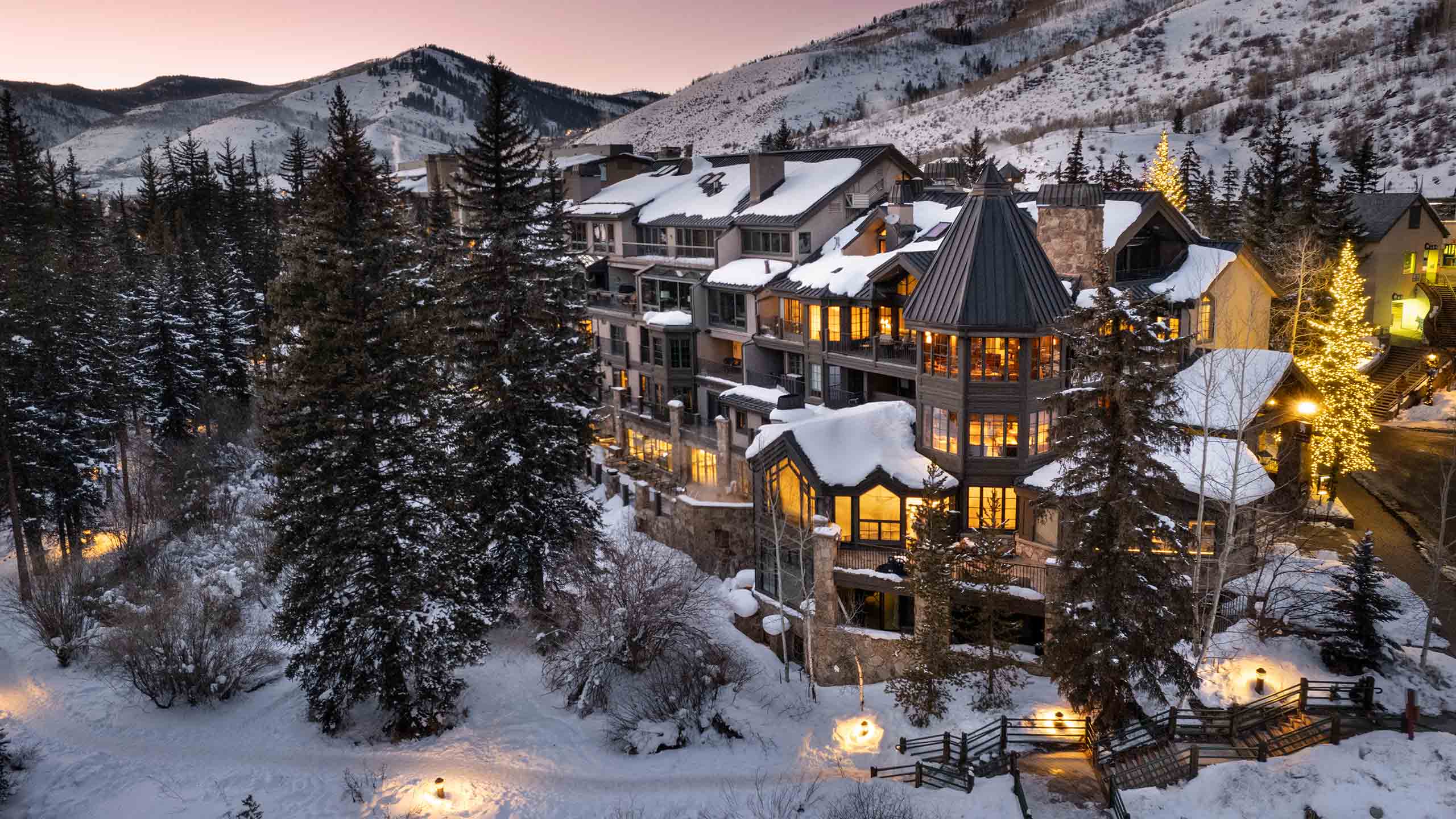 Gravity Haus Vail exterior lit up on a winter eve