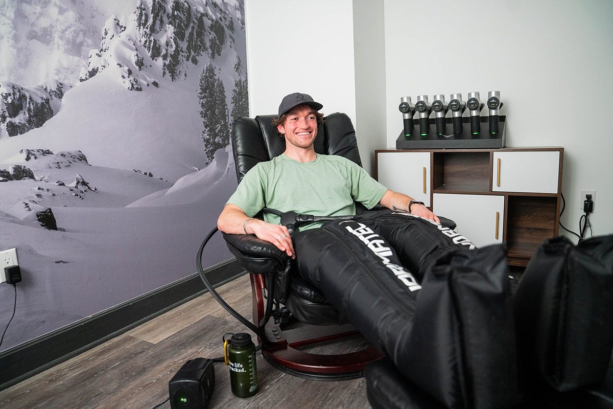 Johnny Kemps using Normatec Compression boots at Dryland Fitness