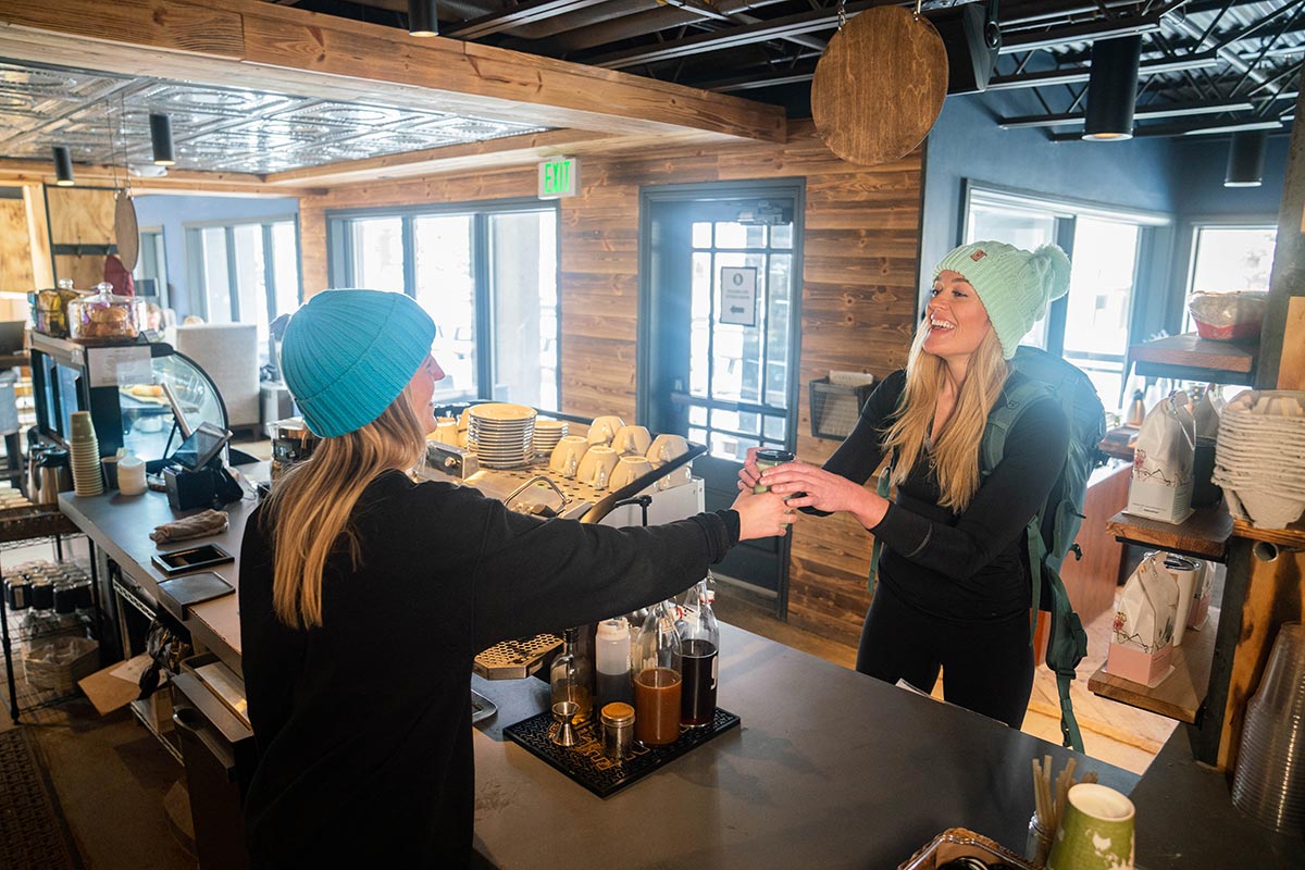 Rachel Carpenter getting a beverage from a barista at Unravel Coffee Breckenridge.