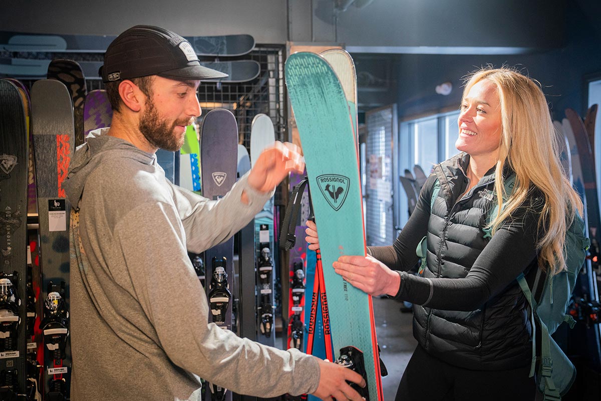 Rachel Carpenter getting demo skis from a teammember at Haus Quiver Breckenridge.
