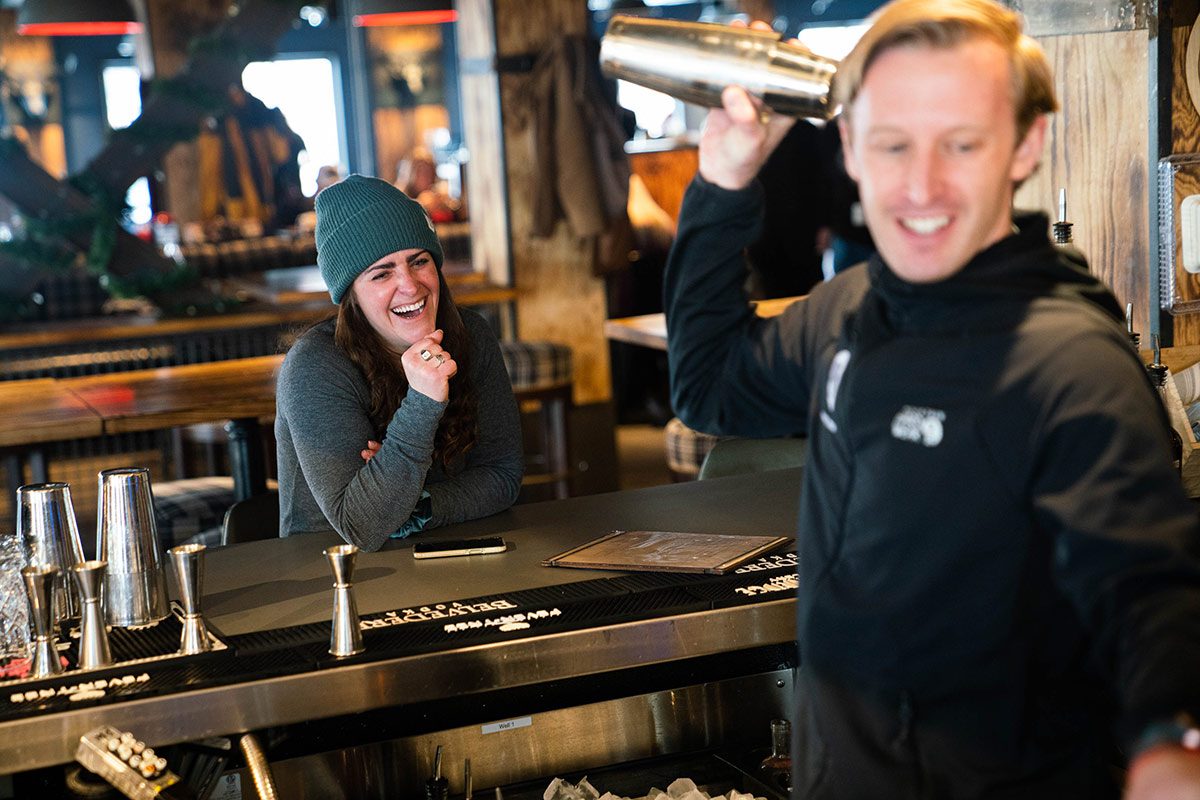 Andrea Rosenthal laughs with the bartender at Cabin Juice.
