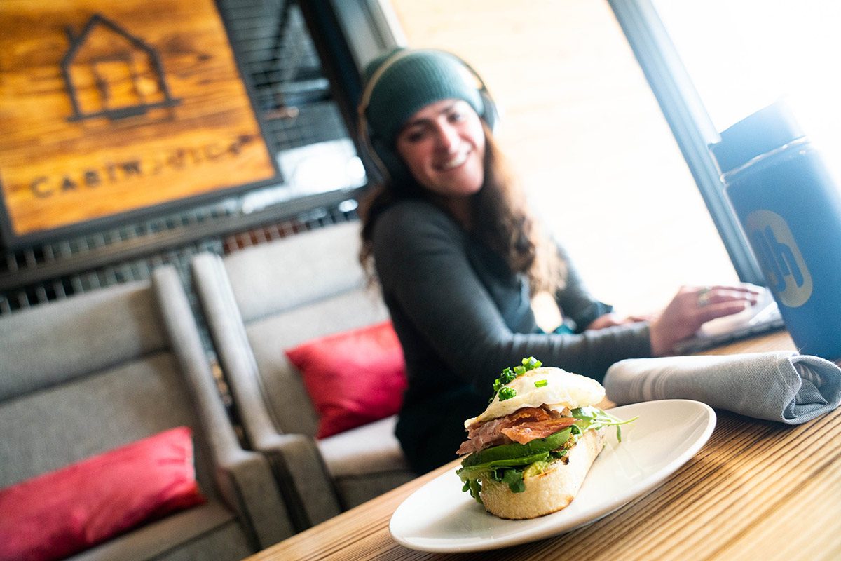 Andrea Rosenthal enjoys a sandwich at Cabin Juice.