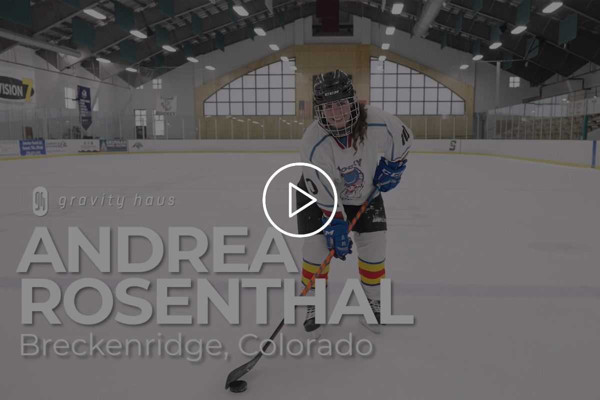 Andrea Rosenthall in hockey gear on the ice rink with Gravity Haus logo and video title overlay