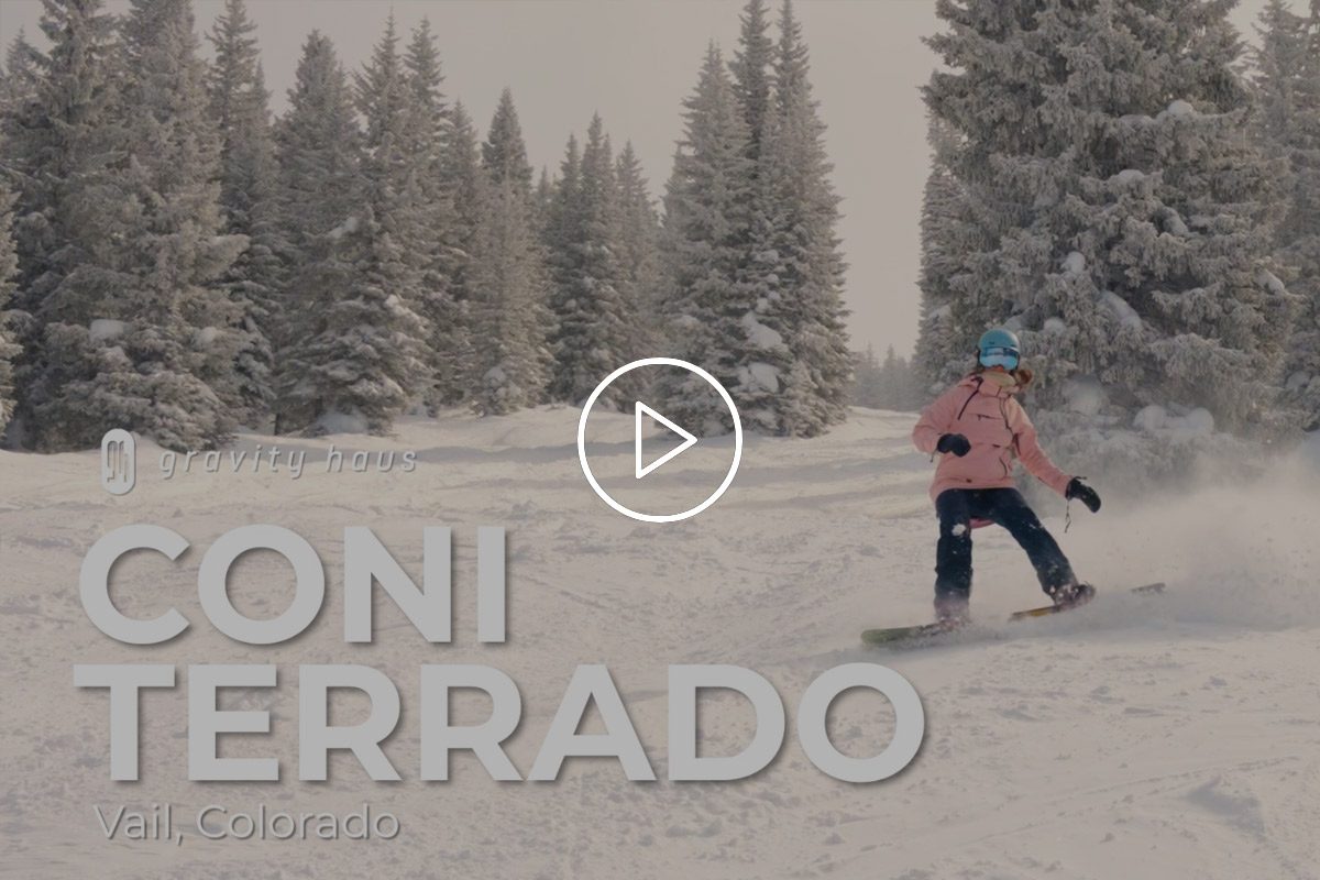 Coni Terrado snowboarding on snowy day.